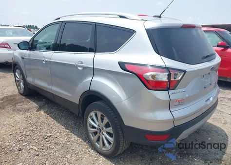 2017 Ford Escape Titanium z USA, uszkodzony, nr VIN 1FMCU0JD8HUE87385